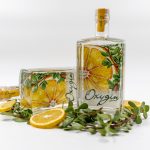 bottle of gin with lemon and mint