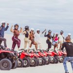 People on quad bikes riding on the Atlantis Dunes