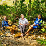 Dan Corder, host of Green Noise - streaming content in the cool waters at CapeNature’s Assegaaibosch Nature Reserve in Stellenbosch - with Julia Louw (Head of Leisure Tourism at Wesgro) and Itumeleng Pooe (Managing Director of Afri-Centric Luxury Travel).