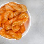 Discover the history, cultural significance and unique preparation of the koeksister, South Africa’s iconic braided, syrup-soaked sweet treat.