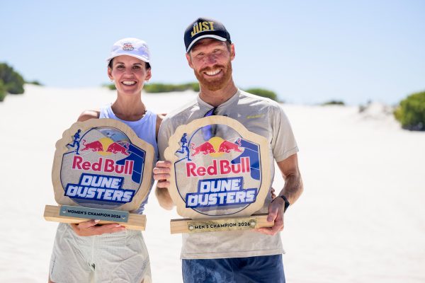 Red Bull Dune Dusters 2026 saw 350 runners tackle a brutal 5km sand elimination race at Atlantis Dunes, with AJ Calitz and Louise Dippenaar crowned champions.