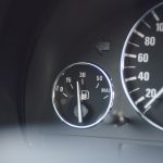 Fuel nozzle at a petrol station following the official July 2026 fuel price decrease.