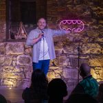 Comedian Dalin Oliver performing his new stand-up show Stuck in Dubai during his 2026 national tour.