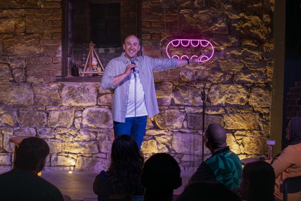 Comedian Dalin Oliver performing his new stand-up show Stuck in Dubai during his 2026 national tour.