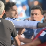 Players and coaching staff from Spain and Argentina clash after the 2026 FIFA World Cup final.