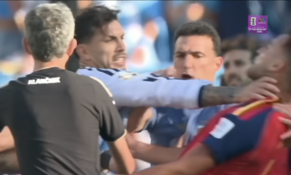 Players and coaching staff from Spain and Argentina clash after the 2026 FIFA World Cup final.
