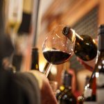 Visitors enjoying wine tasting during Wine Town Stellenbosch at the historic Stellenbosch Town Hall.