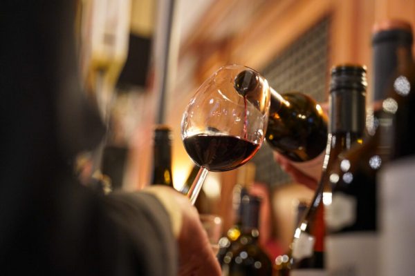 Visitors enjoying wine tasting during Wine Town Stellenbosch at the historic Stellenbosch Town Hall.