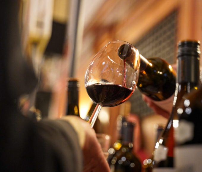 Visitors enjoying wine tasting during Wine Town Stellenbosch at the historic Stellenbosch Town Hall.