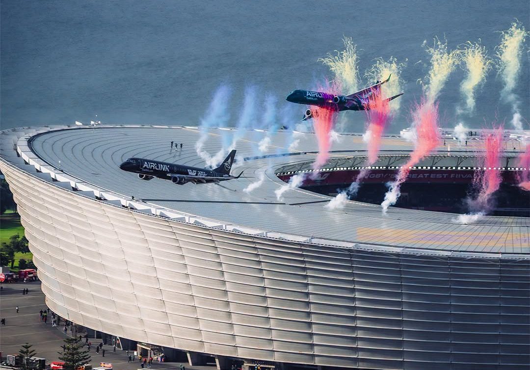Two Airlink passenger jets flying in formation above DHL Stadium in Cape Town
