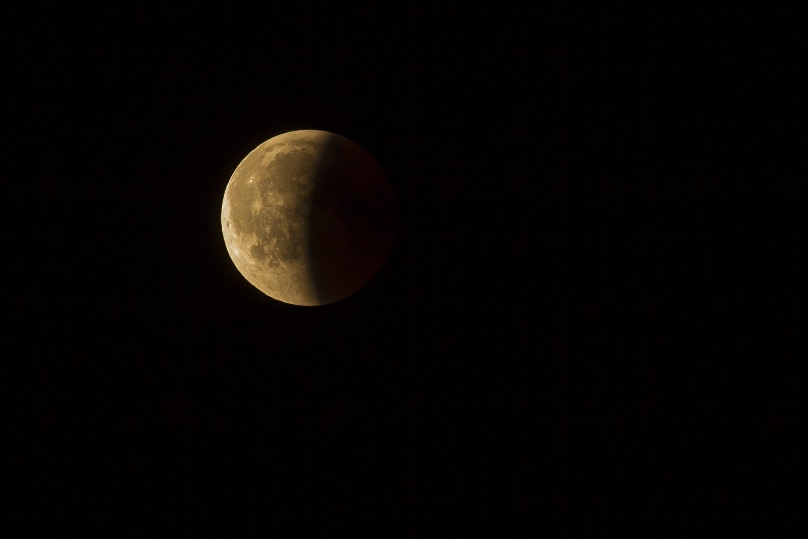 Deep partial lunar eclipse creating a copper-red Moon